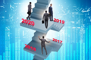 Businessman climbing stairs on yearly basis