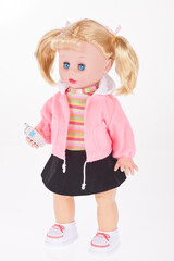 Doll with cell phone toy in white background.