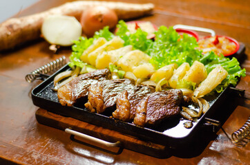 porção de picanha com mandioca
