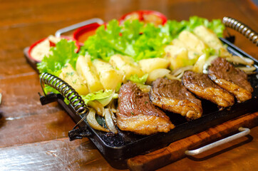 porção de picanha com mandioca