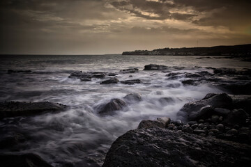 Fototapeta na wymiar Rocks and the Incoming Tide