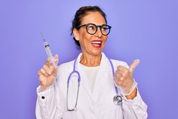 Middle age senior professional doctor woman holding syringe with medical vaccine pointing and showing with thumb up to the side with happy face smiling