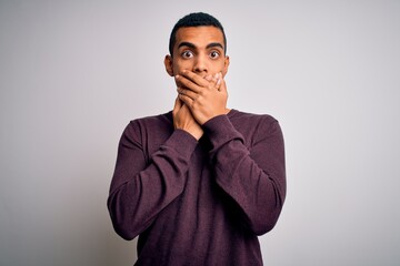 Fototapeta premium Young handsome african american man wearing casual sweater over white background shocked covering mouth with hands for mistake. Secret concept.