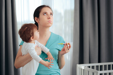 Worried Mom Holding Thermometer Checking Baby Temperature