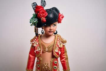 Young little caucasian kid girl wearing  bullfighter traditional folkore spanish suit as carnival...
