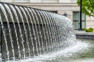 Water fountain trickling on a circular pool outside Utah State Capital Building