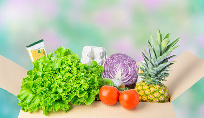 A carton box with products, vegetables, organic food. 