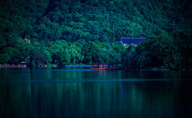 Obraz premium Driving on an antique boat on a calm lake