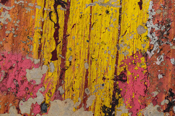 Old concrete wall for backdrop. Streams of multi-colored paint. Peeling, defects. Colors - Blush, Reno Sand, Barberry, Red Devil. Abstract funny bursts.