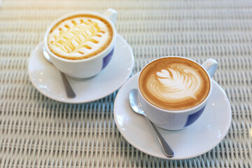 hot caramel macchiato and latte coffee drink put on table in cafe
