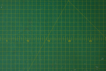 green cutting mat scale with scratch texture from cutter