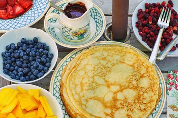 Stack of crepes with fresh fruit