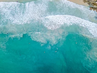 Fotobehang Aerial View With Surfers And Barrel Wave In Ocean © wonderisland