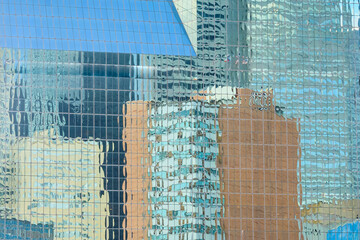 Reflection of skyscrapers on another skyscraper. The picture was taken in Dallas, TX.