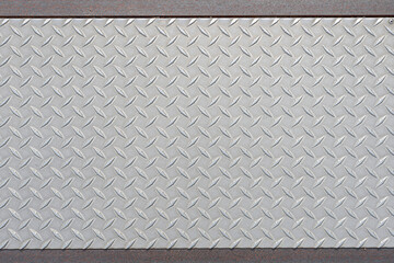 Plate of steel textured on the ground 