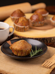 Tasty homemade Banana cake on black plate with hot coffee for snack