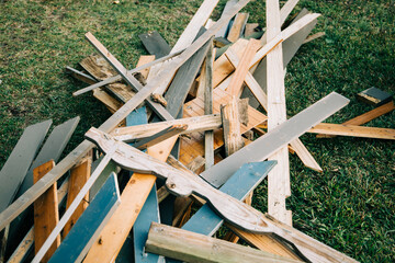 a large pile of scrap wood from a demolished building during the demolition process