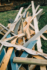 a large pile of scrap wood from a demolished building during the demolition process