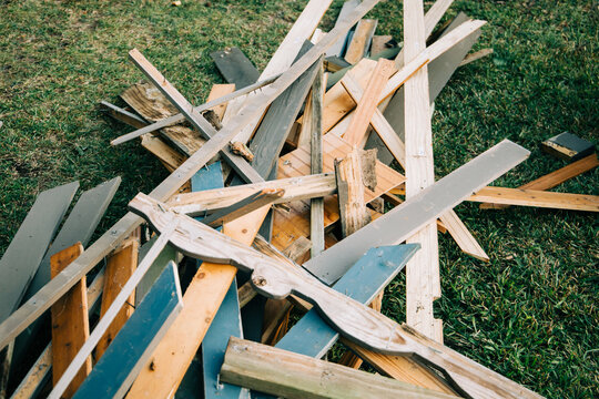 a large pile of scrap wood from a demolished building during the demolition process