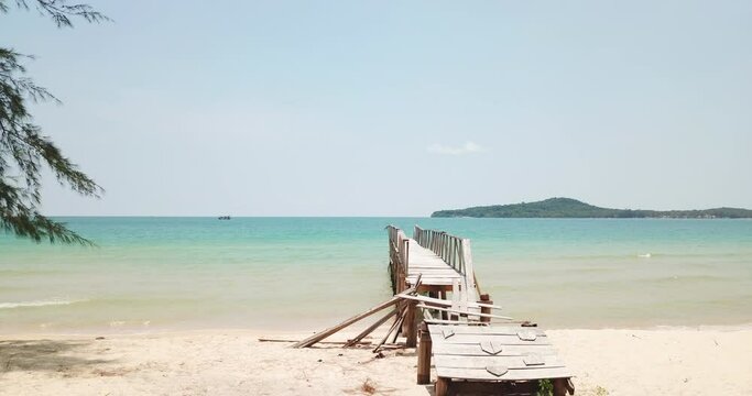 Old wooden bridge at the beach in the Gulf of Thailand in the western part of the South China Sea