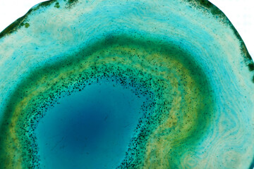 Agate stone  blue macro background.Natural texture of blue stone.Phone wallpaper nature.surface of agate stone.Abstract beautiful background in blue and green tones.