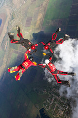 Sports parachutist build a figure in free fall. Extreme sport concept.