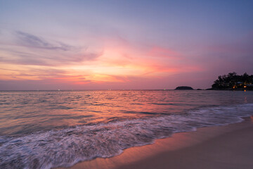 Fototapeta na wymiar Beautiful sunset at tropical beach in summer