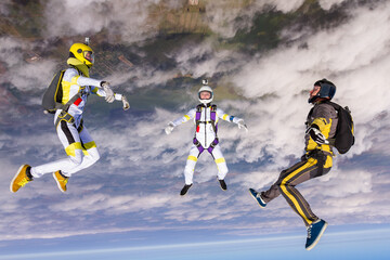 Sports parachutist build a figure in free fall. Extreme sport concept.