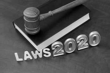 Judge gavel, book and numbers 2020. Concept new laws in year 2020.