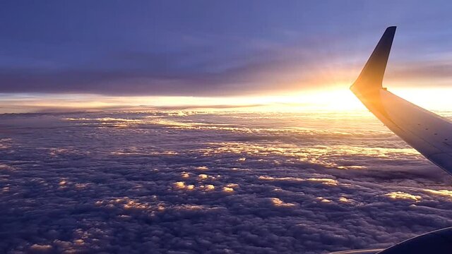 sunset above the cloud view from plane window