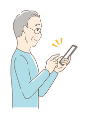 スマホを操作して笑顔な男性の横顔