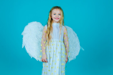 Lovely and cute little Girl angel. Little angel Girl in white dress with angel wings on isolated...