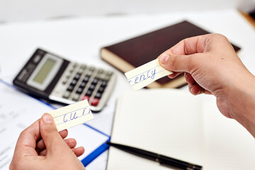 Man tearing paper with word - currency. Symbol of national currency breakdown. Financial Crisis. Currency denomination.