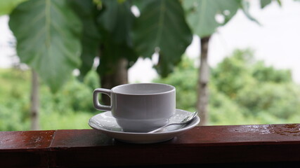 cup of coffee on wooden table