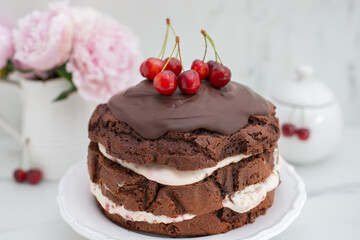 black forest chocolate cake with cherry pie filling with dark chocolate glaze