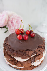 black forest chocolate cake with cherry pie filling with dark chocolate glaze