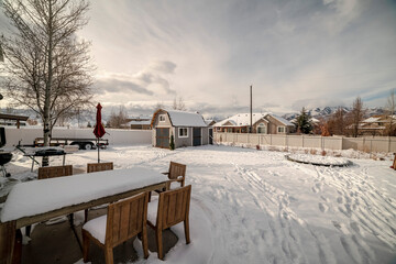 Outdoor wooden furniture in winter snow day light