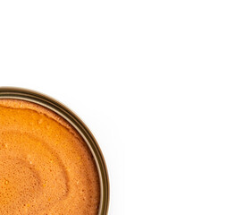 open canned food with pet food on a white background. Selective focus