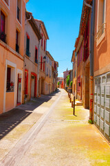 Small town narrow street view with colorful houses in Europe