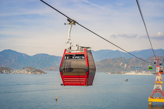 Beautiful cableway on a background of mountains and sea. Cabin cableway. Vacation Concept