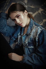 young woman in jeans jacket
