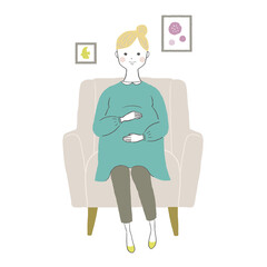 ソファに座る妊婦