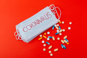 Protective medical mask with the inscription Coronavirus and medicines.