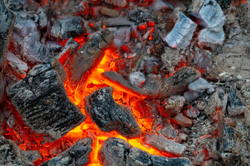 ed-hot coals of a fire close-up macro photo