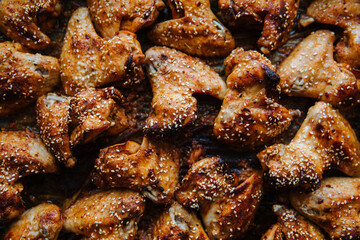 Baked pickled chicken wings. Sprinkled with sesame seeds on top. 
