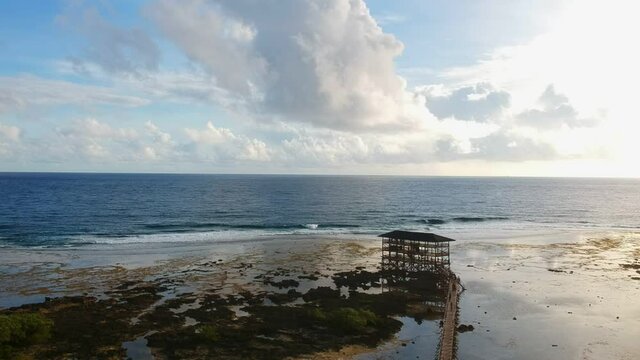 Steady high drone shot of the surfing tower in Siargao