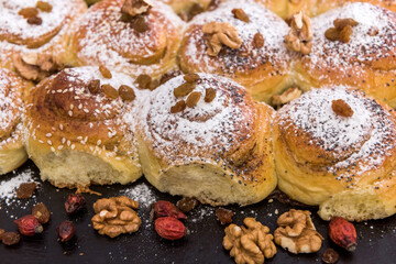 Tasty baked and sprinkled with powdered sugar bagel and bun