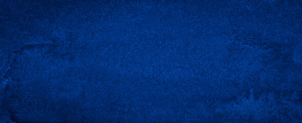 Dark classic blue watercolor background with torn strokes and uneven blurry paint. Abstract background for design, layouts and patterns.