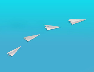 Fototapeta na wymiar Paper Airplanes flying up on blue background