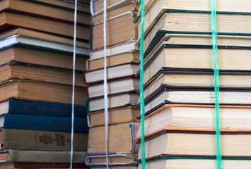 stacks of old books in bundles, like a background
